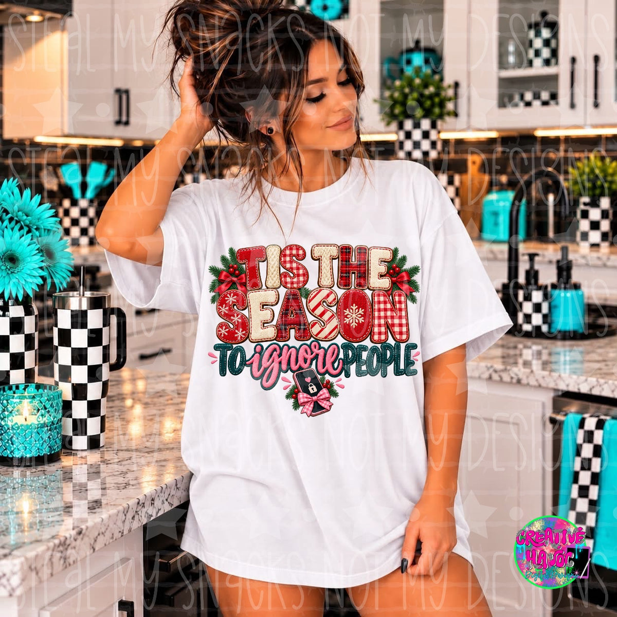 Red and cream patterned lettering with teal script and holly around a holiday quote. Shirt preview.